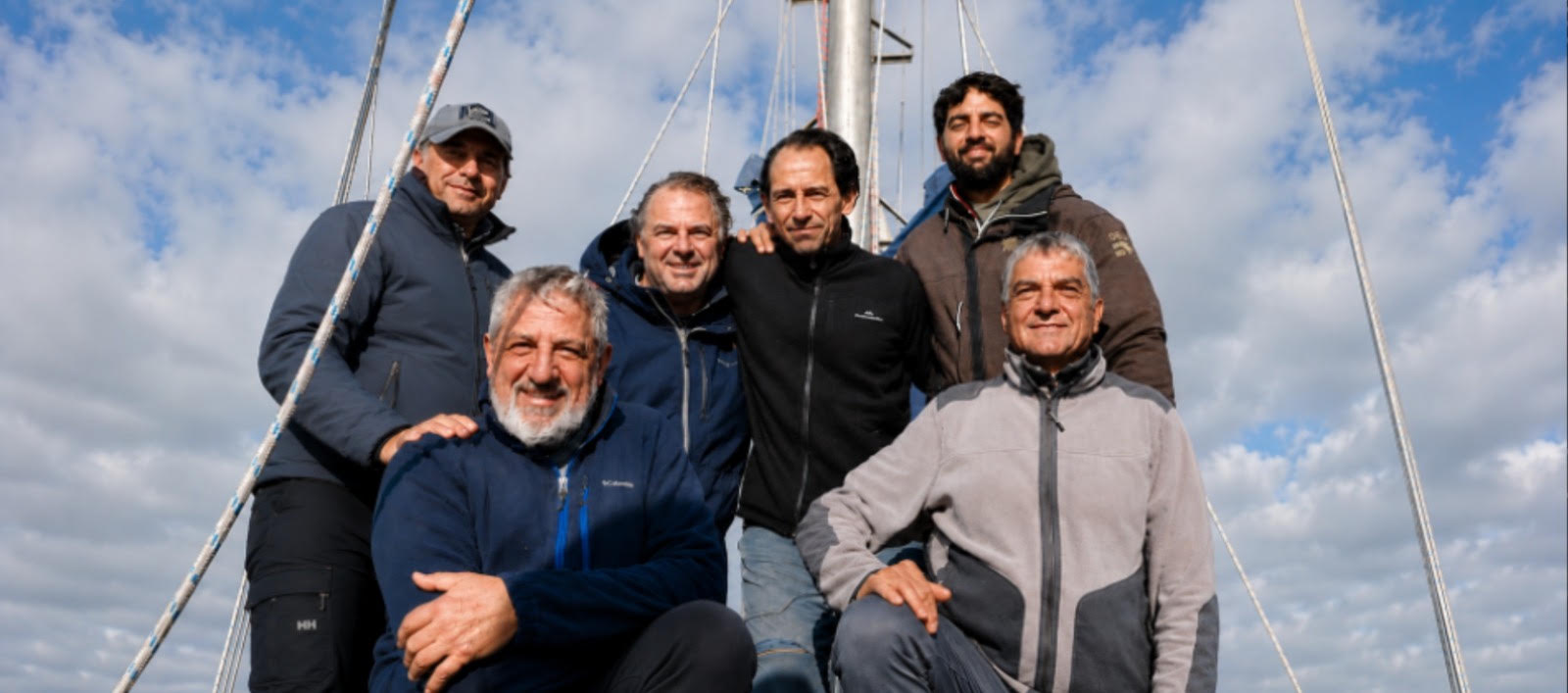 Guests and crew gathered on the deck of El Coronel